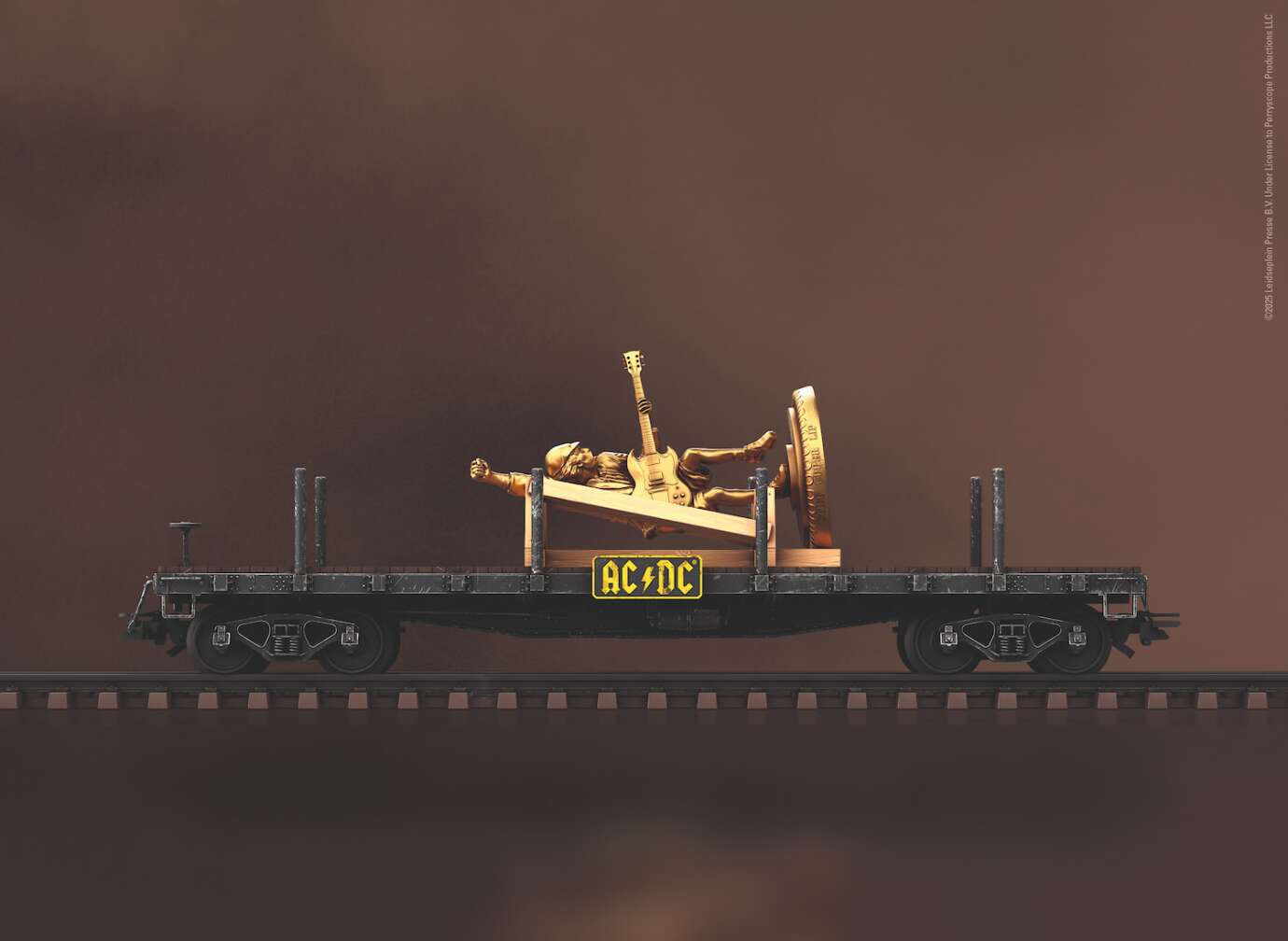Produktfoto der AC/DC Modelleisenbahn-Sonderedition von Märklin, Foto des Waggons Stiff Upper Lipp" mit einer goldenen Statue von Angus Young