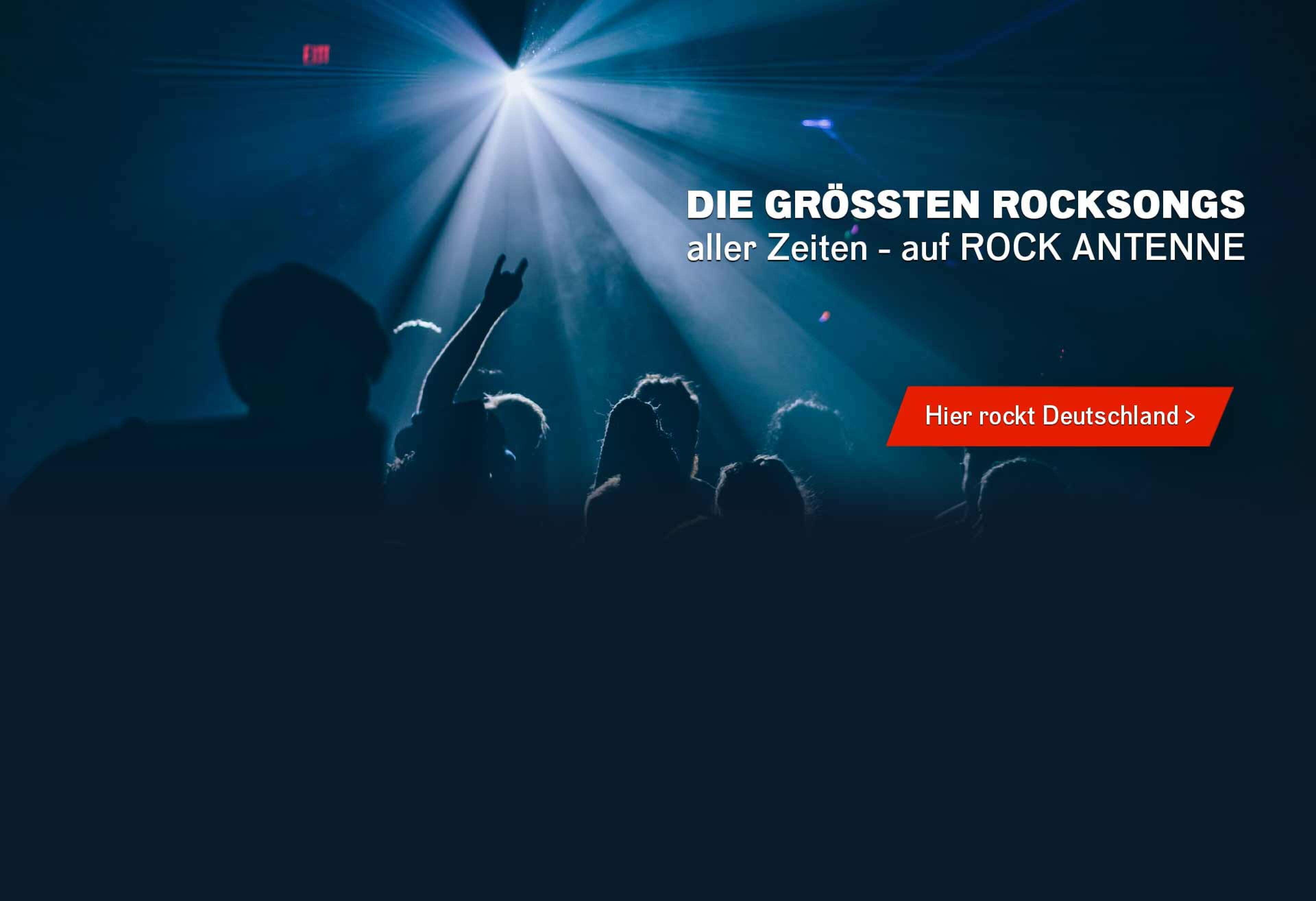 Bild von Konzertpublikum Silhouettenhaft im Gegenlicht, Text